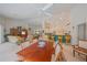 Open living area with dining table, island seating, and views of the living room at 19666 Sw 88Th Loop, Dunnellon, FL 34432
