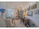 Cozy living room with built-in bookshelves and plenty of natural light at 19666 Sw 88Th Loop, Dunnellon, FL 34432
