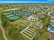 Aerial shot of the community clubhouse, pool, tennis courts, and recreation area at 2136 Kerwood Loop, The Villages, FL 32162