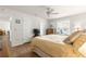 This is a Primary bedroom with a king bed, ceiling fan, dresser and window at 2136 Kerwood Loop, The Villages, FL 32162