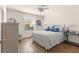 Bedroom featuring a cozy bed, a side table, a window, and a dresser creating a relaxing retreat at 2136 Kerwood Loop, The Villages, FL 32162