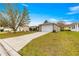 Charming single-Gathering home with a well-maintained lawn and a driveway at 2136 Kerwood Loop, The Villages, FL 32162