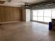 Large garage with an automatic door opener, pegboard walls and plenty of open space at 21623 Regency Park Ln, Leesburg, FL 34748