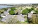 An aerial perspective shows the community with its well-maintained homes and lush landscaping near the lake at 2185 Caxton Ave, Clermont, FL 34711