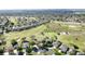 Homes line the green golf course in this elevated aerial view at 2185 Caxton Ave, Clermont, FL 34711