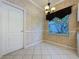 Breakfast nook has tile floors, chair railing, and a window overlooking the yard at 2185 Caxton Ave, Clermont, FL 34711