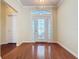 Bright and airy foyer featuring sleek hardwood floors and a decorative glass door at 2185 Caxton Ave, Clermont, FL 34711