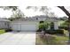 Charming single-Gathering home with a three-car garage, well-maintained landscaping, and a classic facade at 2185 Caxton Ave, Clermont, FL 34711