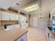 Bright kitchen features white cabinets, stainless steel appliances, and a breakfast nook at 2185 Caxton Ave, Clermont, FL 34711