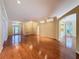 Hardwood floors accentuate the open layout of this bright and airy living room with recessed lighting at 2185 Caxton Ave, Clermont, FL 34711