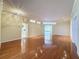Bright living room featuring hardwood floors, neutral paint, decorative lighting, and an open layout at 2185 Caxton Ave, Clermont, FL 34711