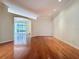 Hardwood floors accentuate the open layout of this bright and airy living room with recessed lighting at 2185 Caxton Ave, Clermont, FL 34711
