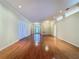 Expansive open-concept living room featuring hardwood floors and decorative lighting at 2185 Caxton Ave, Clermont, FL 34711