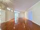 Spacious living room featuring hardwood floors, neutral paint, and an open layout at 2185 Caxton Ave, Clermont, FL 34711