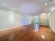 Bright living room with hardwood floors, recessed lighting, and a glass door entry at 2185 Caxton Ave, Clermont, FL 34711