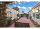 Enjoy a relaxing outdoor seating area with a private brick patio and views of the sky at 2212 Bachman Path, The Villages, FL 32162