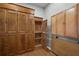 Bedroom with hardwood floors and extensive built-in storage cabinets for all your needs at 2212 Bachman Path, The Villages, FL 32162