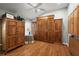 Bright bedroom featuring hardwood floors, vaulted ceiling and large wardrobe storage at 2212 Bachman Path, The Villages, FL 32162