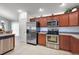 Kitchen with stainless appliances and stylish cabinetry. A functional and modern culinary space at 2212 Bachman Path, The Villages, FL 32162