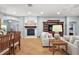 Comfortable living room features a fireplace, built-in shelving, and plenty of space at 2212 Bachman Path, The Villages, FL 32162