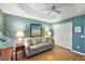 Inviting living room featuring comfortable seating, neutral colors, and stylish decor at 2212 Bachman Path, The Villages, FL 32162