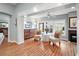 Inviting sitting room with large windows, hardwood floors, comfortable seating, and a cozy fireplace at 2212 Bachman Path, The Villages, FL 32162