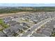 An aerial view showcases a neighborhood featuring well-maintained homes and landscaping at 2289 Mystic Maze Ln, Minneola, FL 34715