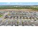 An aerial view highlights a specific home in the community with harmonious architecture and manicured lawns at 2289 Mystic Maze Ln, Minneola, FL 34715