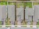 An aerial view captures the property lines, streetscape, manicured lawns, and rooflines at 2289 Mystic Maze Ln, Minneola, FL 34715