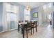 Charming dining area with modern lighting and a view of the entrance hall at 2289 Mystic Maze Ln, Minneola, FL 34715