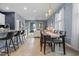 Open-concept dining area adjacent to the kitchen and living room, perfect for gatherings at 2289 Mystic Maze Ln, Minneola, FL 34715