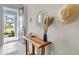 Inviting entryway featuring a rustic wood table and decorative wall accents at 2289 Mystic Maze Ln, Minneola, FL 34715