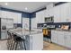 Beautiful kitchen featuring a large island with bar seating, stainless appliances, and ample counter space at 2289 Mystic Maze Ln, Minneola, FL 34715