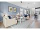 Cozy living room featuring comfortable seating, light blue walls, and neutral décor at 2289 Mystic Maze Ln, Minneola, FL 34715
