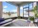 Relaxing screened patio featuring comfortable seating and views of the backyard at 2289 Mystic Maze Ln, Minneola, FL 34715