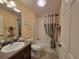 Standard bathroom featuring a single vanity, toilet and shower with neutral toned decor at 2304 Jonesbury Run, The Villages, FL 32162