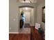 Inviting foyer with decorative furnishings and an arched doorway, creating a warm entrance at 2304 Jonesbury Run, The Villages, FL 32162