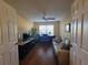 Cozy living room with a ceiling fan, a comfortable sofa and a view from the entry at 2304 Jonesbury Run, The Villages, FL 32162