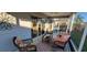 Relaxing screened patio with comfortable seating, perfect for enjoying the outdoors at 2304 Jonesbury Run, The Villages, FL 32162