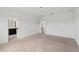 Neutral carpeting in this bedroom leads to the en-suite bath with dual vanity at 2331 Sanderling St, Haines City, FL 33844