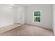 Living room area featuring tile flooring and a window at 2331 Sanderling St, Haines City, FL 33844