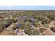 Aerial view of a large property surrounded by mature trees, outlined in blue at 2541 Lake Griffin Rd, Lady Lake, FL 32159