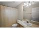 Standard bathroom featuring a single sink, toilet, and a shower/tub combo with neutral color palette at 2541 Lake Griffin Rd, Lady Lake, FL 32159