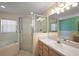 Bathroom featuring a glass-enclosed shower, bathtub, and vanity with sink at 2541 Lake Griffin Rd, Lady Lake, FL 32159