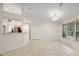 Open concept dining area with tile floor and an adjacent open kitchen at 2541 Lake Griffin Rd, Lady Lake, FL 32159