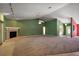 Spacious living room featuring carpet floors, fireplace, and large windows at 2541 Lake Griffin Rd, Lady Lake, FL 32159