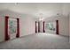Large main bedroom featuring carpet, ceiling fan, and windows with natural light at 2541 Lake Griffin Rd, Lady Lake, FL 32159