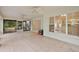 Spacious screened porch with tile flooring, offering a transition to indoor and outdoor living at 2541 Lake Griffin Rd, Lady Lake, FL 32159
