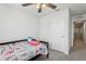 Bedroom features a ceiling fan and a door to the hallway at 255 Blueberry Ln, Davenport, FL 33837