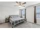 Bright bedroom with a bed, large window allowing natural light and a ceiling fan at 255 Blueberry Ln, Davenport, FL 33837